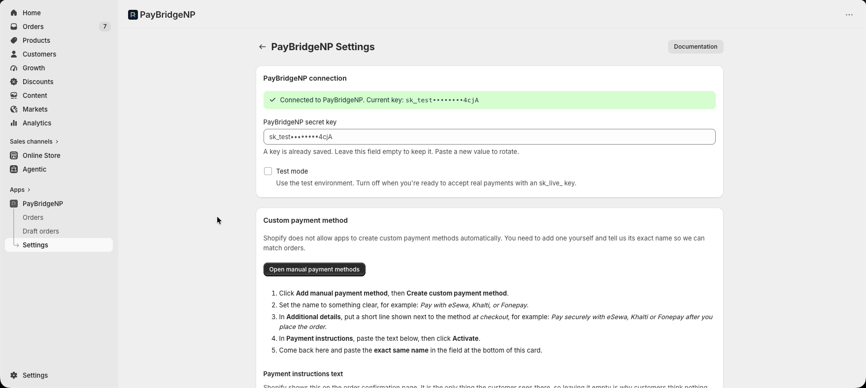 The Settings page showing a successful PayBridgeNP connection with the API key masked, a Test mode toggle, and instructions for creating a custom payment method in Shopify admin.